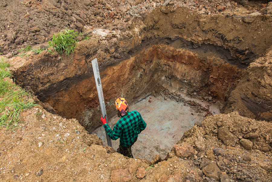 A man installing the septic tank